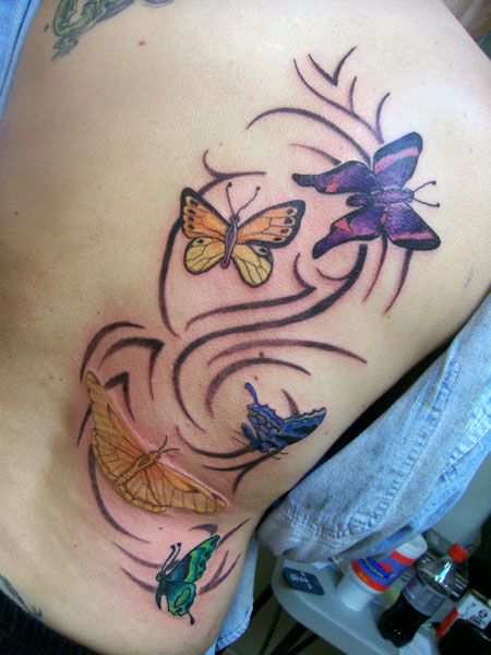 butterflies - chest tattoo