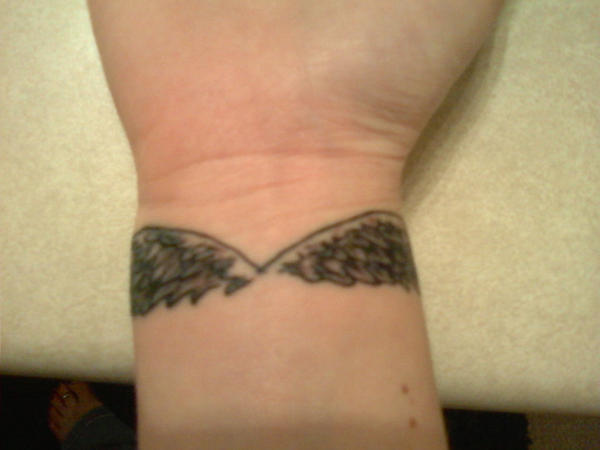 Small Wings Tattoo On Wrist