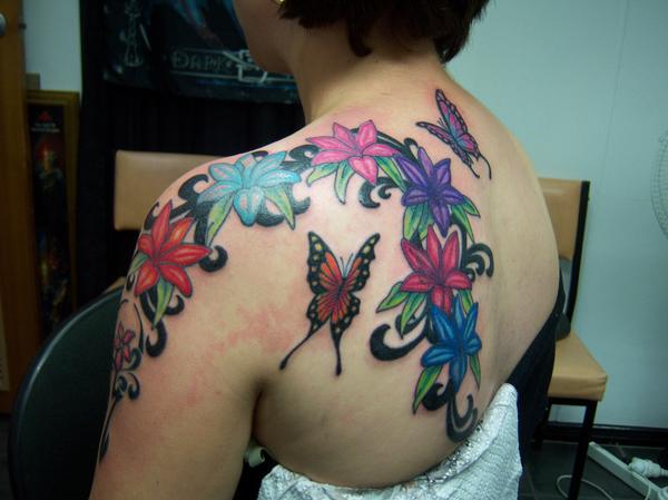 flower back and arm tatt by