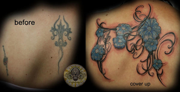 chicano tattoos. flower tattoos on spine.