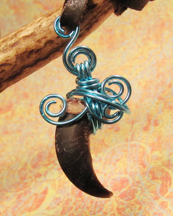  - blue_moon___wire_wrapped_wolf_claw_pendant_by_morrokko-d4jyvo9