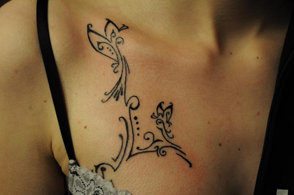 ornamented breast tattoos